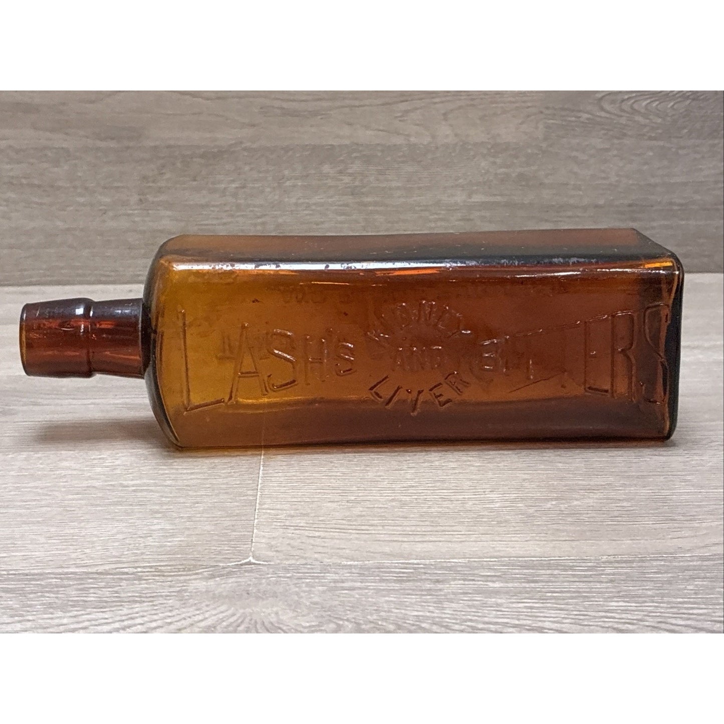 ANTIQUE LASH'S KIDNEY AND LIVER BITTERS CATHARTIC AMBER GLASS EMBOSSED BOTTLE 9”