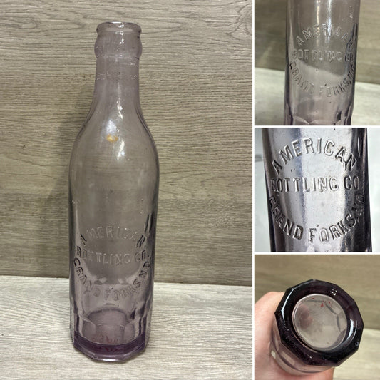 VINTAGE AMETHYST! GRAND FORKS ND BLOWN SODA BOTTLE AMERICAN BOTTLING CO 8.5”