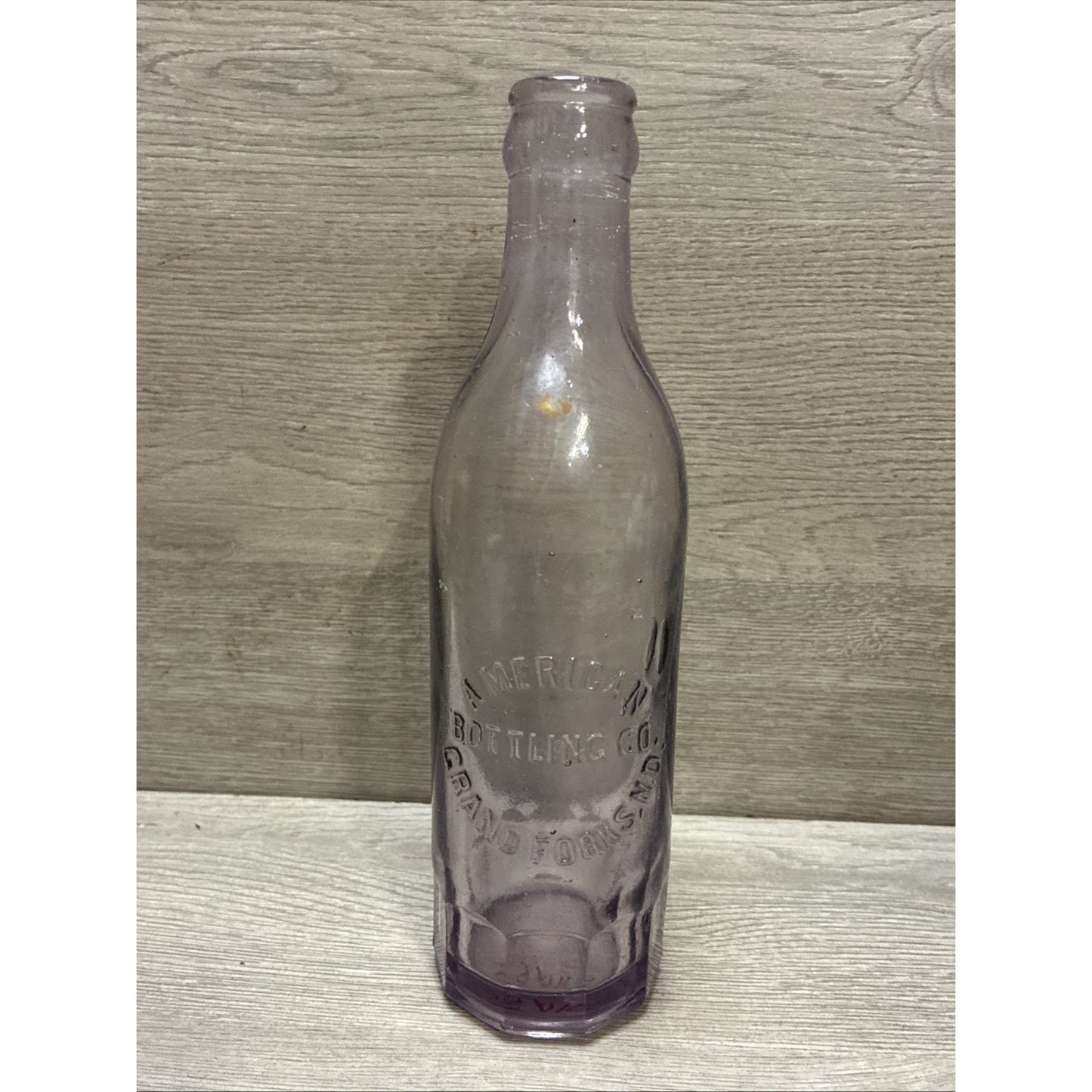 VINTAGE AMETHYST! GRAND FORKS ND BLOWN SODA BOTTLE AMERICAN BOTTLING CO 8.5”