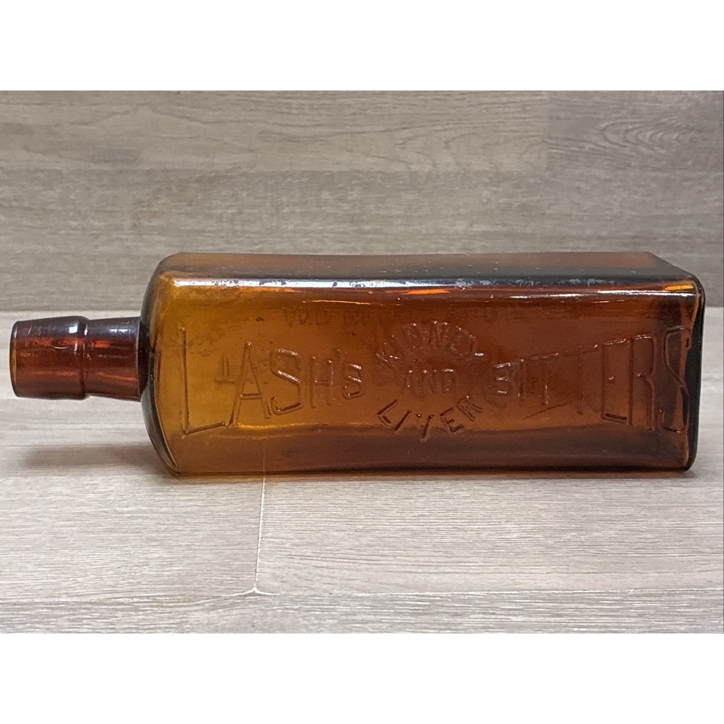 ANTIQUE LASH'S KIDNEY AND LIVER BITTERS CATHARTIC AMBER GLASS EMBOSSED BOTTLE 9”